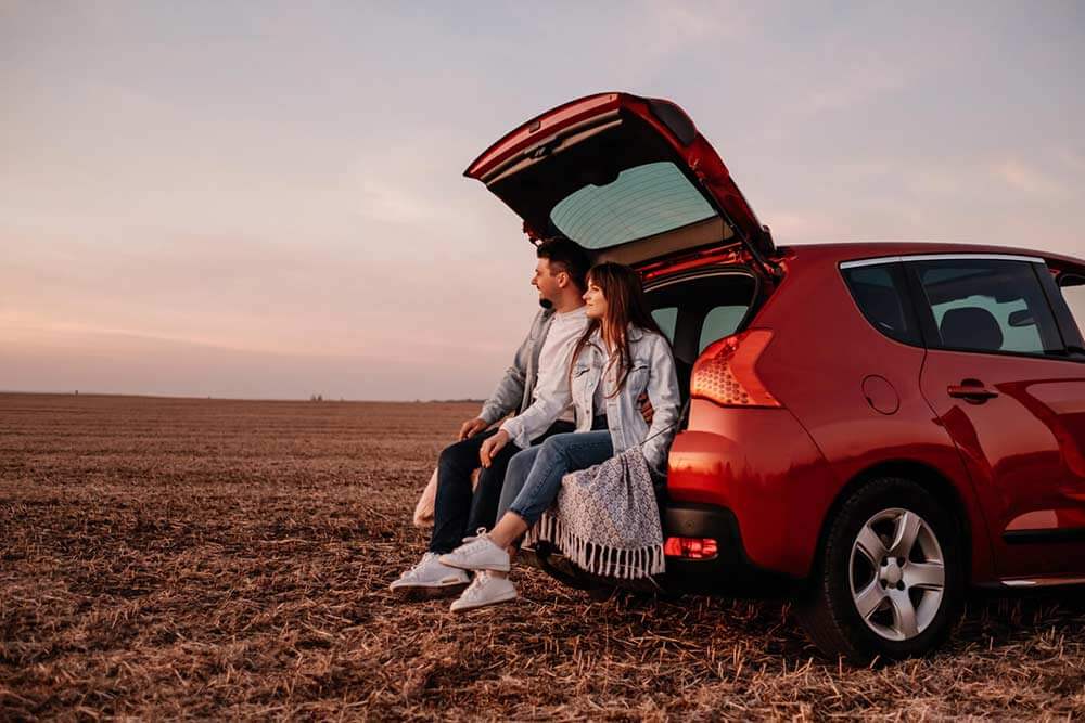 Couple excited about new car